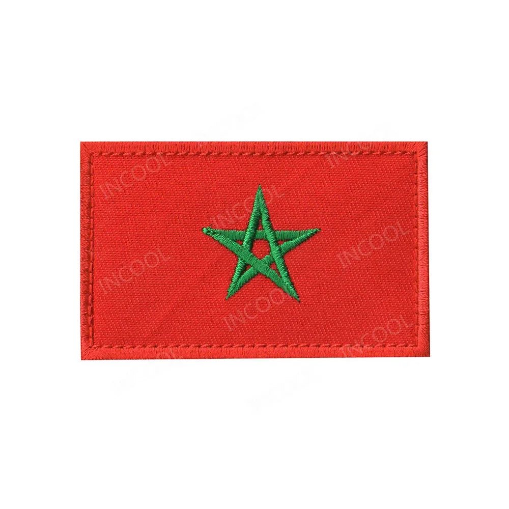 Embroidery patches of African flags and badges featuring Morocco, Nigeria, Gabon, Libya, and Namibia by MANDOTOS INTERNATIONAL.