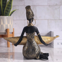 African girl holding a plate sculpture for home and office décor, vintage collectible craft by MANDOTOS INTERNATIONAL.