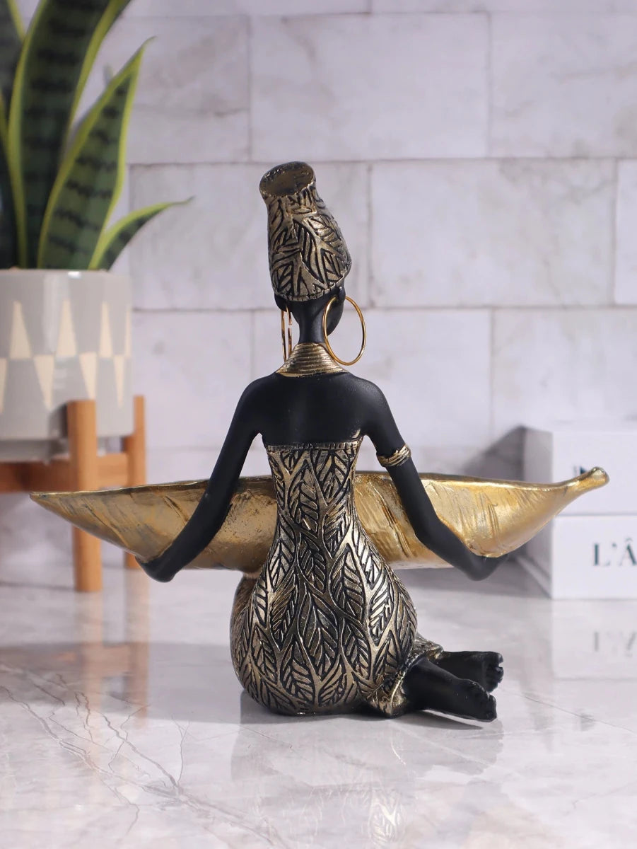 African girl holding a plate sculpture for home and office décor, vintage collectible craft by MANDOTOS INTERNATIONAL.