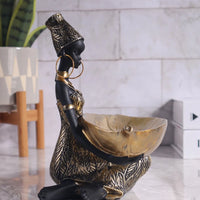 African girl holding a plate sculpture, vintage decorative storage ornament for home and office, collectible craft by MANDOTOS INTERNATIONAL.