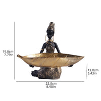 African girl holding a plate sculpture by MANDOTOS INTERNATIONAL, vintage decorative storage ornament for home or office decor.