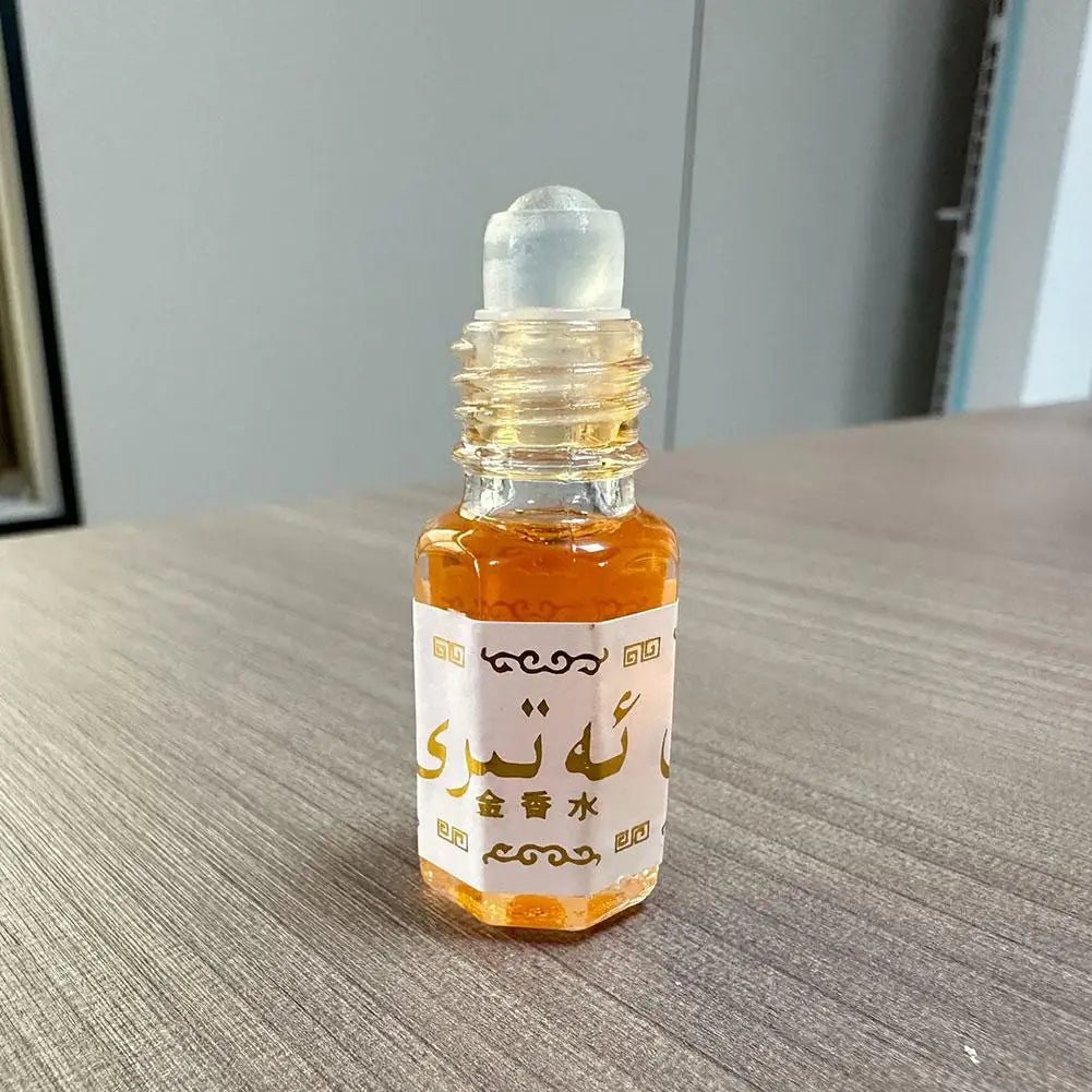 Mandotos International Arabian Gold perfume roll-on for unisex, featuring a long-lasting scent in a sleek glass bottle.