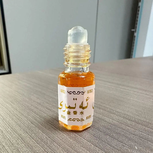 Mandotos International Arabian Gold perfume roll-on for unisex, featuring a long-lasting scent in a sleek glass bottle.
