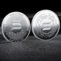 Mandotos International crypto coin collection featuring Bitcoin, Ethereum, Dogecoin, and more in a plastic case, made of metal.