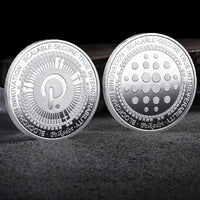 Mandotos International crypto coin collection featuring physical Bitcoin, Ethereum, ADA, Shiba Inu, Dogecoin, Ripple, and more in a plastic case.
