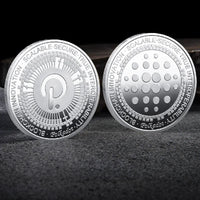 Mandotos International crypto coin collection featuring physical Bitcoin, Ethereum, ADA, Shiba Inu, Dogecoin, Ripple, and more in a plastic case.