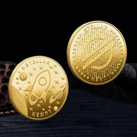 Mandotos International collection of physical metal crypto coins including Bitcoin, Ethereum, Dogecoin, and more in a plastic case.