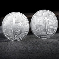 Mandotos International collection of physical metal crypto coins including Bitcoin, Ethereum, Dogecoin, and more in plastic case.