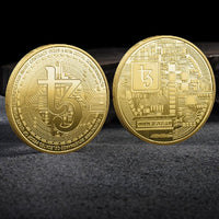 Mandotos International collection of physical metal cryptocurrency coins including Bitcoin, Ethereum, Dogecoin, and more in a plastic case.
