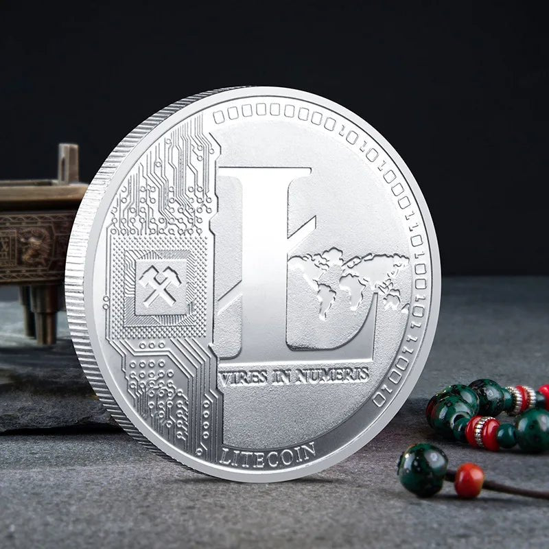 Mandotos International physical metal crypto currency coin collection featuring Bitcoin, Ethereum, Dogecoin, Shiba Inu, and more in a plastic case.