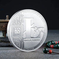 Mandotos International physical metal crypto currency coin collection featuring Bitcoin, Ethereum, Dogecoin, Shiba Inu, and more in a plastic case.