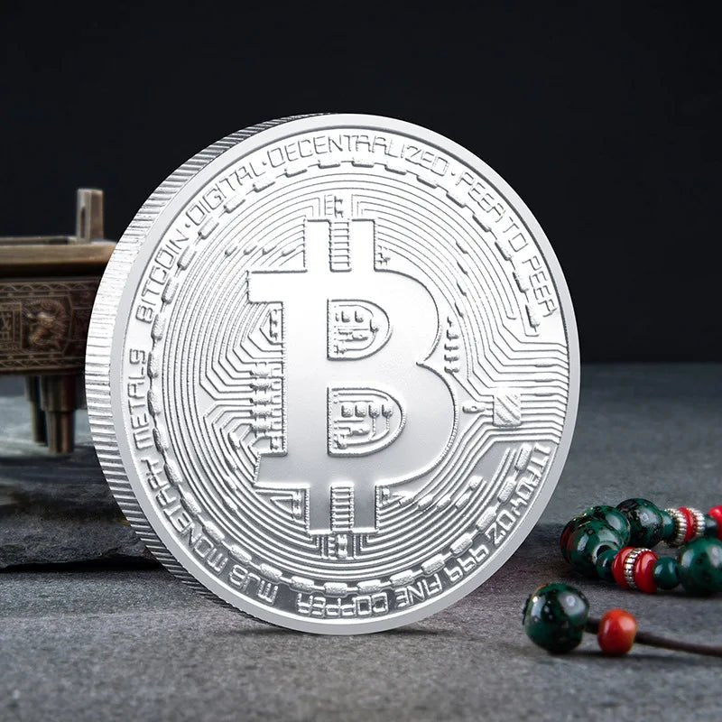 Mandotos International collection of physical metal crypto coins including Bitcoin, Ethereum, Dogecoin, and more in a plastic case.