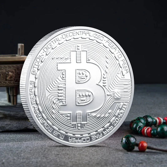Mandotos International collection of physical metal crypto coins including Bitcoin, Ethereum, Dogecoin, and more in a plastic case.