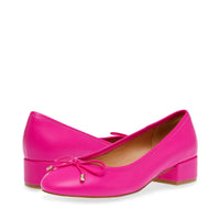 Pink leather pump with a sleek design and 6.5 size by MANDOTOS INTERNATIONAL, featuring a stylish heel and pointed toe.