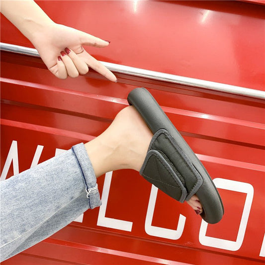 Chic grey beach sandals with comfort sole from MANDOTOS INTERNATIONAL, featuring a stylish open-toe design and cushioned footbed.