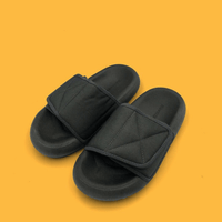 Chic grey beach sandals from MANDOTOS INTERNATIONAL with a comfortable sole and stylish design for casual wear.