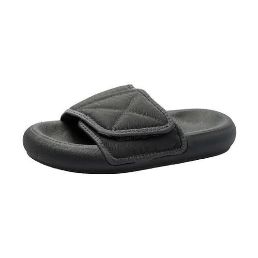 Chic grey beach sandals from MANDOTOS INTERNATIONAL with a comfortable sole and stylish design for seaside wear.