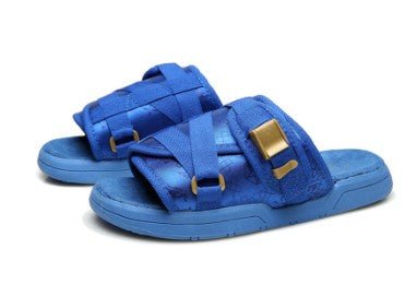 Chic unisex beach slides by MANDOTOS INTERNATIONAL with stylish open-toe design and comfortable flat sole.