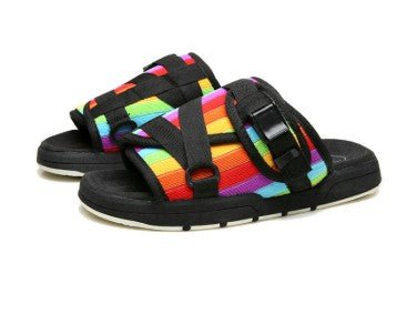 Chic unisex beach slides from MANDOTOS INTERNATIONAL with comfortable straps and stylish design for casual summer wear.