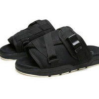 Chic unisex beach slides by MANDOTOS INTERNATIONAL with stylish design and comfortable slip-on style for casual summer wear.