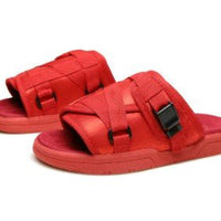 Chic unisex beach slides by MANDOTOS INTERNATIONAL with stylish design and comfortable straps for casual summer wear.