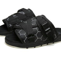 Chic unisex beach slides by MANDOTOS INTERNATIONAL featuring stylish design and comfortable slip-on style for beachwear.