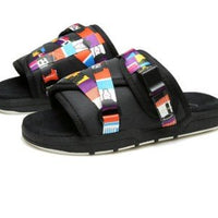 Chic unisex beach slides by MANDOTOS INTERNATIONAL featuring stylish design and comfortable sandal straps.