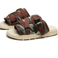 Chic unisex beach slides by MANDOTOS INTERNATIONAL featuring stylish design and comfortable slip-on style for summer.