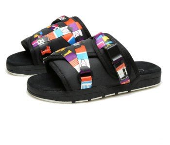 Chic unisex beach slides by MANDOTOS INTERNATIONAL with stylish design and comfortable straps, perfect for casual summer wear.