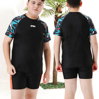 Mandotos International boys' swim trunks from 2026, two-piece youth swimwear with colorful design, suitable for older children.