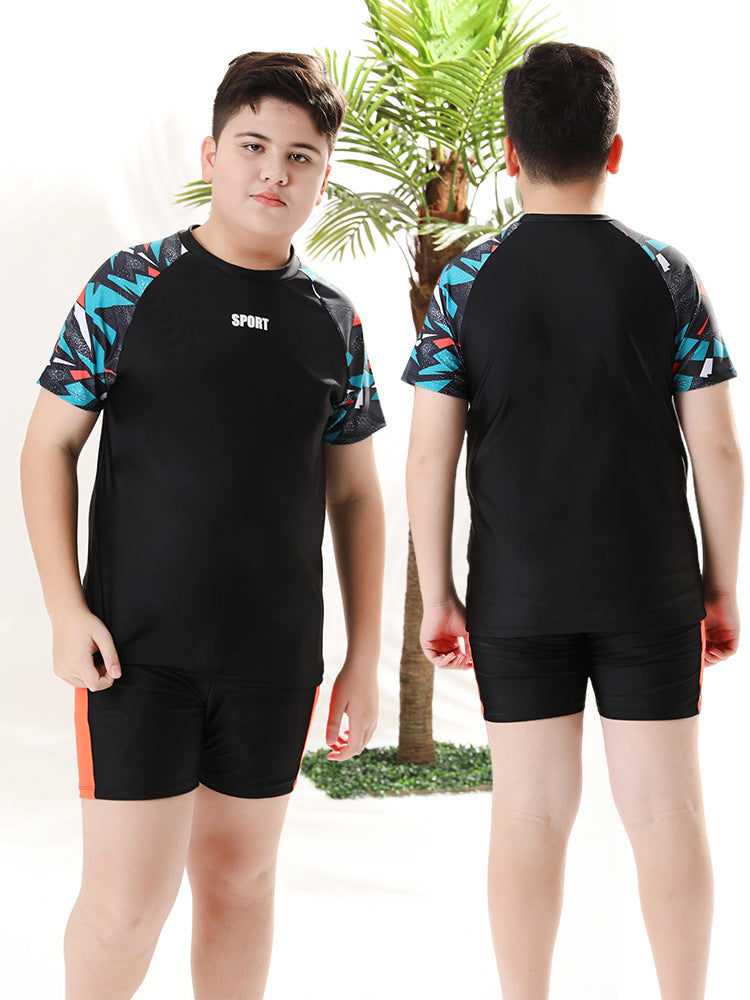 Mandotos International boys' swim trunks from 2026, two-piece youth swimwear with colorful design, suitable for older children.