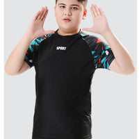 Mandotos International boys' swim trunks from 2026, two-piece youth swimwear for older children, featuring vibrant springtime design.
