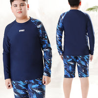 Children's boys' two-piece swim trunks by Mandotos International, sun-protective swimwear for older boys in a hot spring setting.