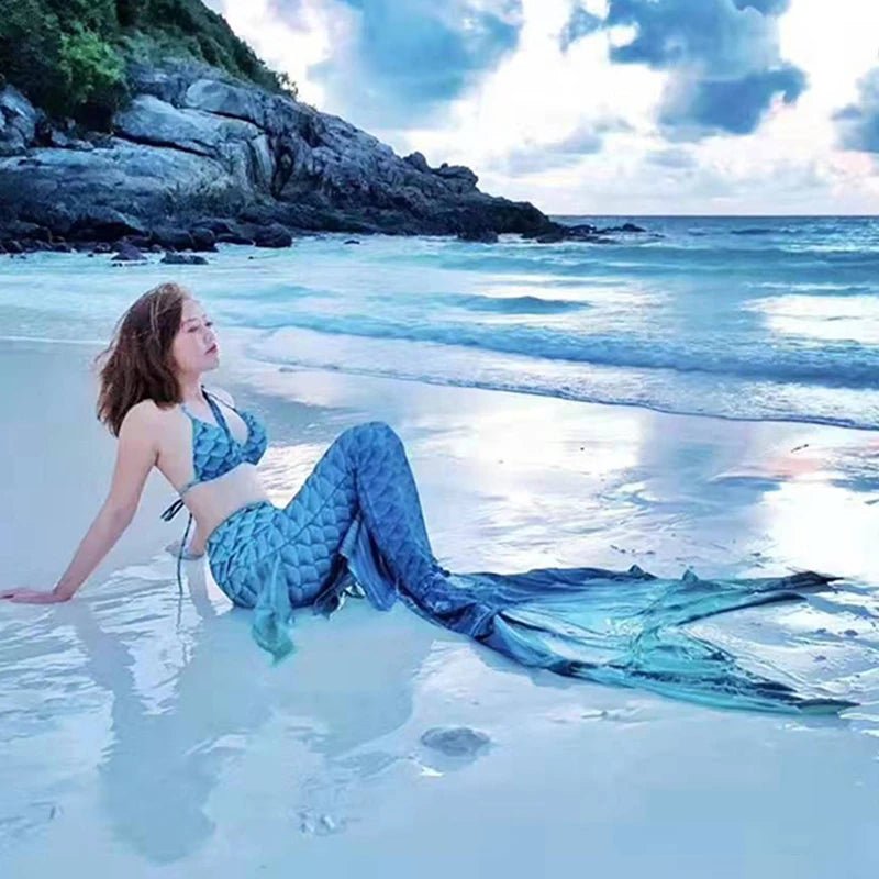 Shiny mermaid tails swimsuit by MANDOTOS INTERNATIONAL featuring a colorful, scale-like pattern for swimming and costume wear.