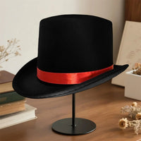 Elegant black top hat for adults, perfect for magician costumes, featuring a classic design by MANDOTOS INTERNATIONAL.