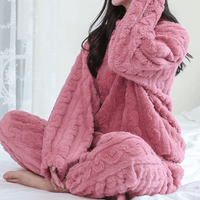 Mandotos International cozy coral velvet sleepwear set featuring a long-sleeve top and matching pants for comfortable lounging.
