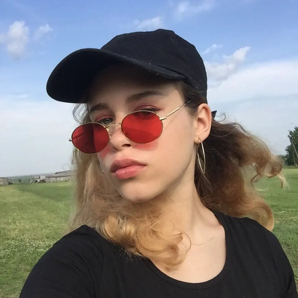 Round metal frame sunglasses with custom logo by Mandotos International, showcasing a stylish and durable eyewear design.
