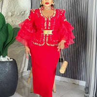 Elegant African V-neck maxi dress by MANDOTOS INTERNATIONAL, featuring vibrant fabric and flowing design for wedding parties.