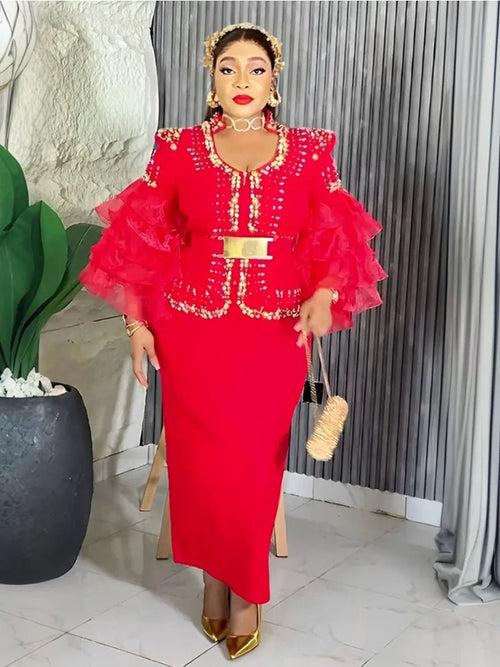 Elegant African V-neck maxi dress by MANDOTOS INTERNATIONAL, featuring vibrant fabric and flowing design for wedding parties.
