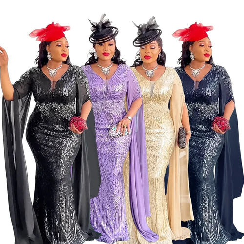 Elegant African V-neck maxi dress by MANDOTOS INTERNATIONAL, featuring vibrant fabric and flowing silhouette for wedding parties.