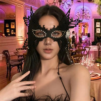 Elegant velvet Enigma mask by MANDOTOS INTERNATIONAL, designed for Halloween and masquerade balls, featuring intricate detailing.