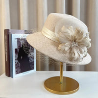 Elegant floral top hat from MANDOTOS INTERNATIONAL, ideal for autumn winter fashion, weddings, and parties for women.