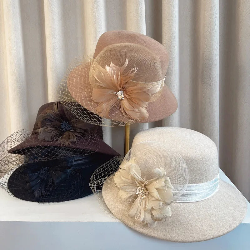 Elegant floral top hats for women in autumn and winter, perfect for weddings and parties, by MANDOTOS INTERNATIONAL.