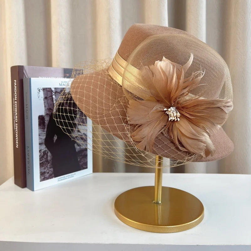 Elegant floral top hat for women, suitable for autumn and winter fashion, weddings, and parties, by MANDOTOS INTERNATIONAL.