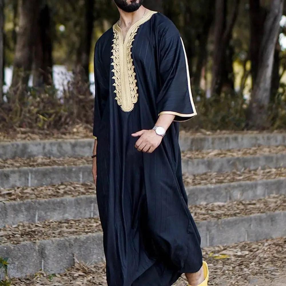 Elegant men's black linen robe by Mandotos International, showing the soft fabric and relaxed fit on a hanger.
