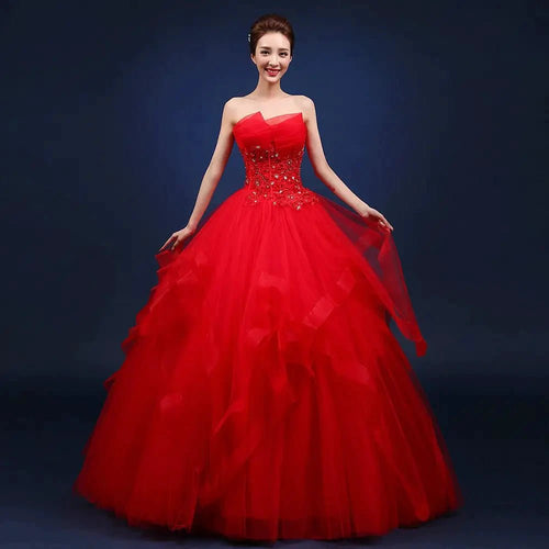 Elegant one-shoulder bridal gown by MANDOTOS INTERNATIONAL featuring flowing fabric and intricate design for special occasions.
