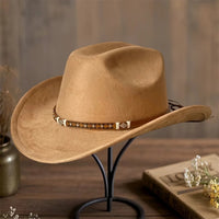 Embellished unisex cowboy hat by MANDOTOS INTERNATIONAL with decorative accents, perfect for stylish outdoor adventures.