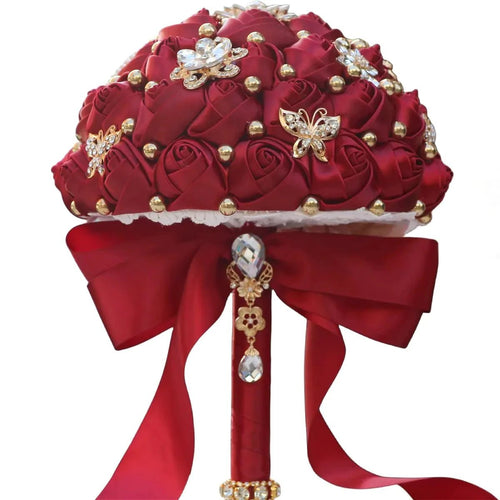 Dark red eternal rose bridal bouquet by MANDOTOS INTERNATIONAL with lush, long-lasting roses for weddings and special occasions.