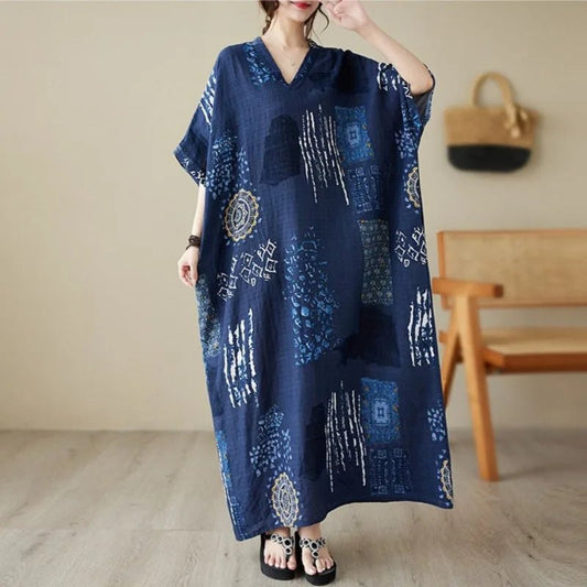 Casual ethnic bohemian beach dress for women by MANDOTOS INTERNATIONAL, featuring flowing fabric and vibrant patterns.
