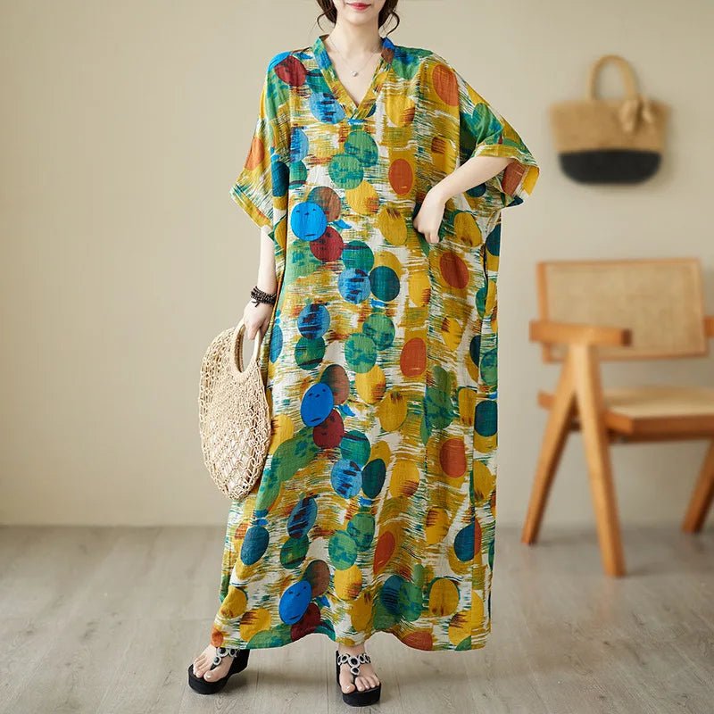 Women’s ethnic bohemian beach dress by MANDOTOS INTERNATIONAL, casual fashion style with colorful patterns and flowing fabric.